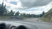 I give the finger to the taxi driver on a busy road in Colombia