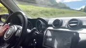 I give the finger to the taxi driver on a busy road in Colombia