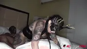 Three inked up hotties worship a giant cock!