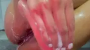 Hot brunette stimulates her pussy to squirt