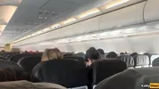 Giving a blowjob on a plane before I get caught with dick in my mouth