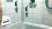 Short, tiny amateur masturbates at home with a fake dick and stream of water