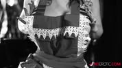Luna Luxxx teasing in a black and white classic scene