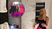 Big tits big ass hot sexy beauty in the bathroom with the short pink skirt shows her braless boobs and long legs