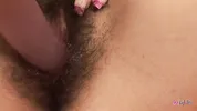 Teen wearing lingerie smiles for the camera and rides her favorite dildo