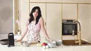 On the film set, the cameraman fucked a feminine makeup artist and a busty food blogger.