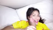 beautiful young Colombian girl lets her face be filled with milk during the World Cup