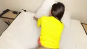 beautiful young Colombian girl lets her face be filled with milk during the World Cup