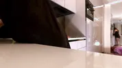 Hot sexy long legs brunette wife in black and red fishnet stockings with a satin nightie teases in the kitchen