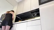 Hot sexy long legs brunette wife in black and red fishnet stockings with a satin nightie teases in the kitchen