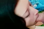 Young brunette loves to suck a big cock outdoors