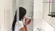 Hot sexy slim tight pussy beauty in the bathroom prepares for night out in a pink cut mini skirt