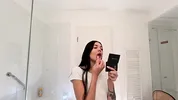 Hot sexy slim tight pussy beauty in the bathroom prepares for night out in a pink cut mini skirt