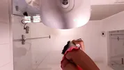 Hot sexy slim tight pussy beauty in the bathroom prepares for night out in a pink cut mini skirt