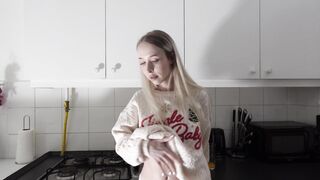 Amazingly beautiful petite blonde hot college girl in her dormitory kitchen getting ready for Christmas Party