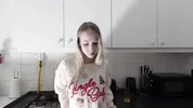 Amazingly beautiful petite blonde hot college girl in her dormitory kitchen getting ready for Christmas Party