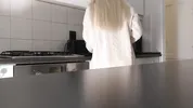 Amazingly beautiful petite blonde hot college girl in her dormitory kitchen getting ready for Christmas Party