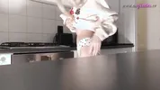 Amazingly beautiful petite blonde hot college girl in her dormitory kitchen getting ready for Christmas Party