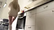 Amazingly beautiful petite blonde hot college girl in her dormitory kitchen getting ready for Christmas Party