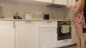 Super hot girl in no panties in a fully see through transparent dress in the kitchen to flash pussy