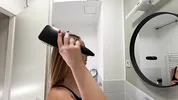 Amazingly beautiful college girl in the bathroom with a super skirt miniskirt shows her ass
