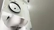 Amazingly beautiful college girl in the bathroom with a super skirt miniskirt shows her ass