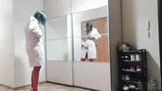 I undress in front of the mirror, and then masturbate and squirt