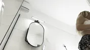 Big boobs hot blonde in a cut modified short mini skirt in the bathroom shows her big tits and legs