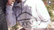 German vacationer gives her boyfriend a blowjob by the sea