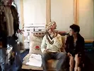 Geeky brunette seduces older stud to fuck her on the sofa