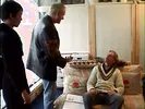Geeky brunette seduces older stud to fuck her on the sofa