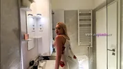 Sexy beauty cute blonde horny girl in pink panties and with a satin nightie does the bathroom routine before going to the bed