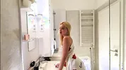 Sexy beauty cute blonde horny girl in pink panties and with a satin nightie does the bathroom routine before going to the bed