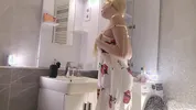 Sexy beauty cute blonde horny girl in pink panties and with a satin nightie does the bathroom routine before going to the bed