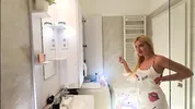 Sexy beauty cute blonde horny girl in pink panties and with a satin nightie does the bathroom routine before going to the bed