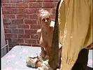 Blonde whore with big fake boobs has pussy pumped in the prison cell