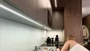 Big boobs blonde hot college girl in a mini skirt do house chores and flashes her legs and ass