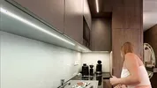 Big boobs blonde hot college girl in a mini skirt do house chores and flashes her legs and ass
