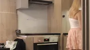 Big boobs blonde hot college girl in a mini skirt do house chores and flashes her legs and ass