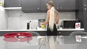 Hot tattooed blonde long hair beauty in the kitchen takes her panties off to show her meaty pussy an