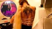 Hot tattooed blonde long hair beauty in the kitchen takes her panties off to show her meaty pussy an