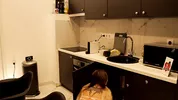 Hot tattooed blonde long hair beauty in the kitchen takes her panties off to show her meaty pussy an