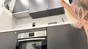 Hot tattooed blonde long hair beauty in the kitchen takes her panties off to show her meaty pussy an