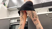 Hot tattooed blonde long hair beauty in the kitchen takes her panties off to show her meaty pussy an