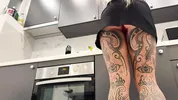 Hot tattooed blonde long hair beauty in the kitchen takes her panties off to show her meaty pussy an