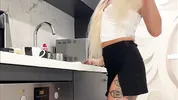 Hot tattooed blonde long hair beauty in the kitchen takes her panties off to show her meaty pussy an