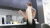 Hot tattooed blonde long hair beauty in the kitchen takes her panties off to show her meaty pussy an