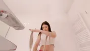Amazingly beautiful college girl prepares for a night out with a short cut mini skirt to flash pussy