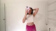 Amazingly beautiful college girl prepares for a night out with a short cut mini skirt to flash pussy