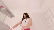 Amazingly beautiful college girl prepares for a night out with a short cut mini skirt to flash pussy